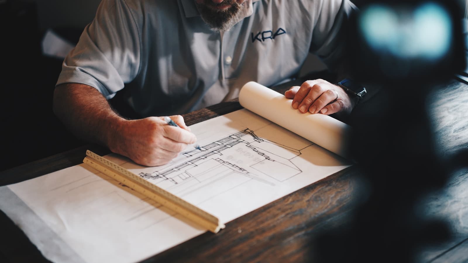 Joiner setting out a drawing on the workbench